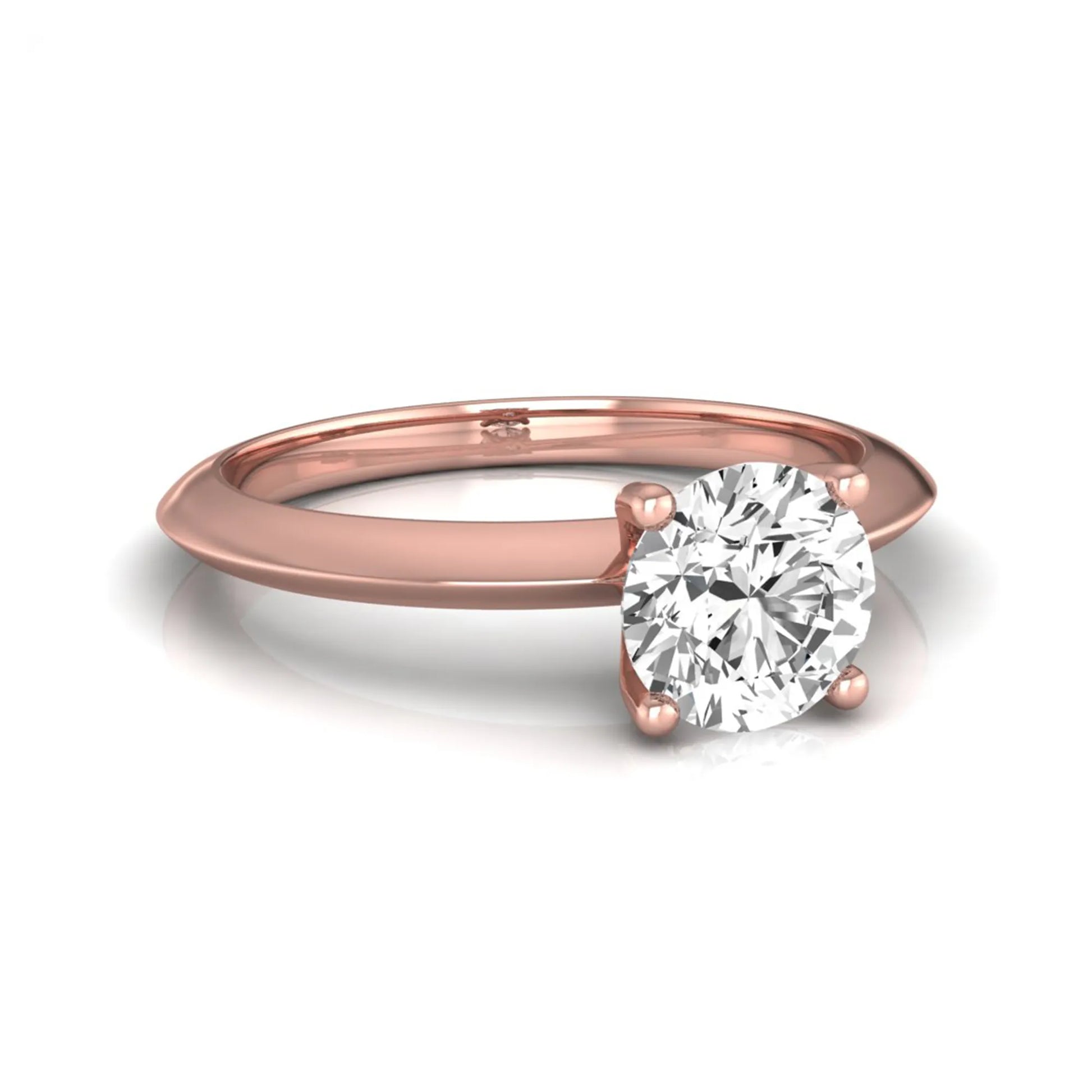 Round four prong lab grown diamond solitaire engagement ring featuring a 0.80 carat round cut center diamond in a classic rose gold design.