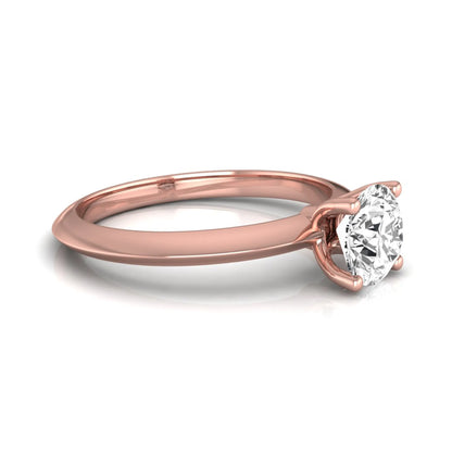 Round four prong lab grown diamond solitaire engagement ring featuring a 0.80 carat round cut center diamond in a classic rose gold design.