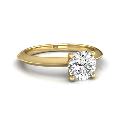 Round four prong lab grown diamond solitaire engagement ring featuring a 0.80 carat round cut center diamond in a classic yellow gold design.