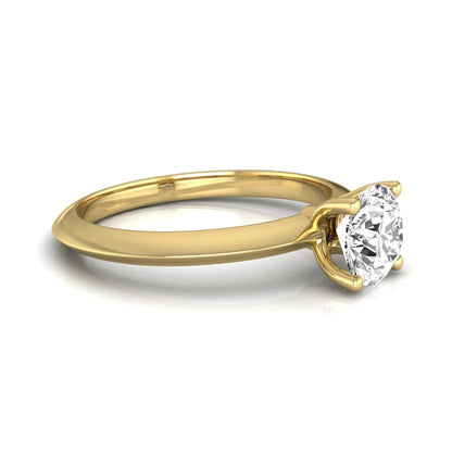 Round four prong lab grown diamond solitaire engagement ring featuring a 0.80 carat round cut center diamond in a classic yellow gold design.