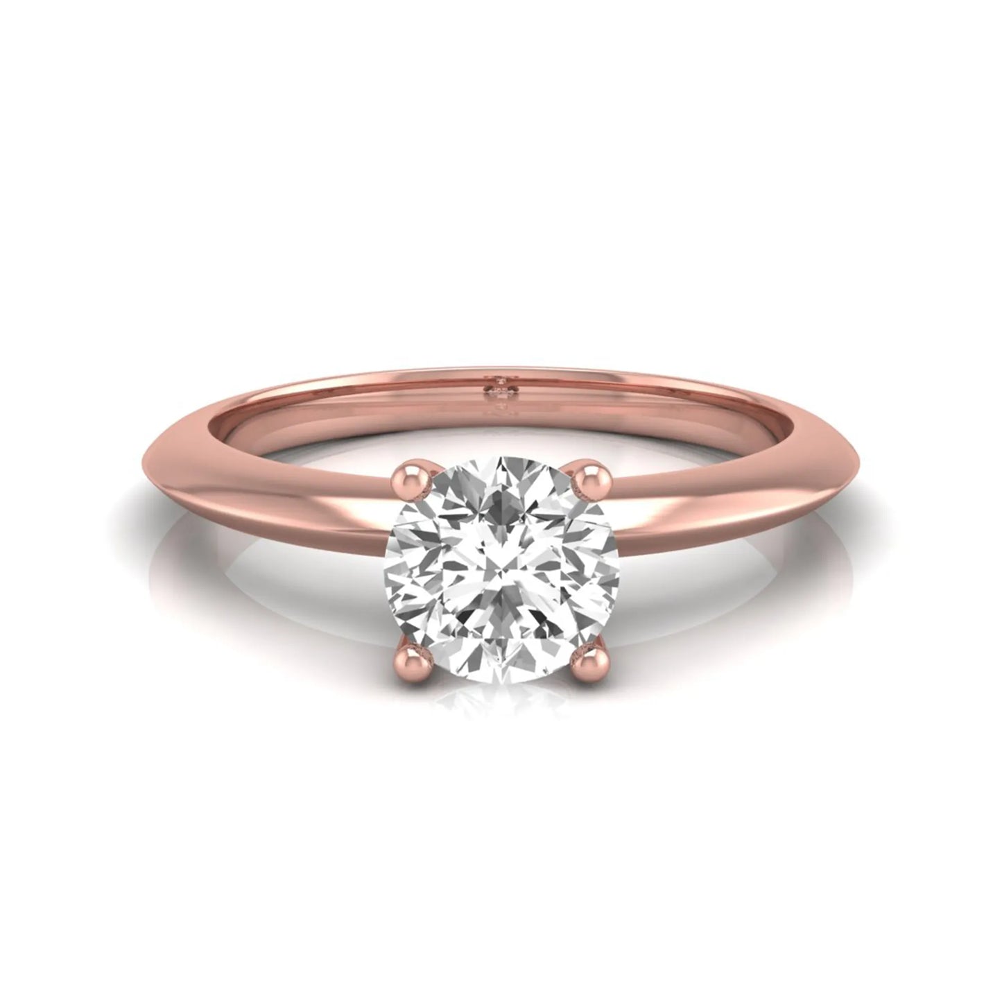 Round four prong lab grown diamond solitaire engagement ring featuring a 0.55 carat round cut center diamond in a classic rose gold design.