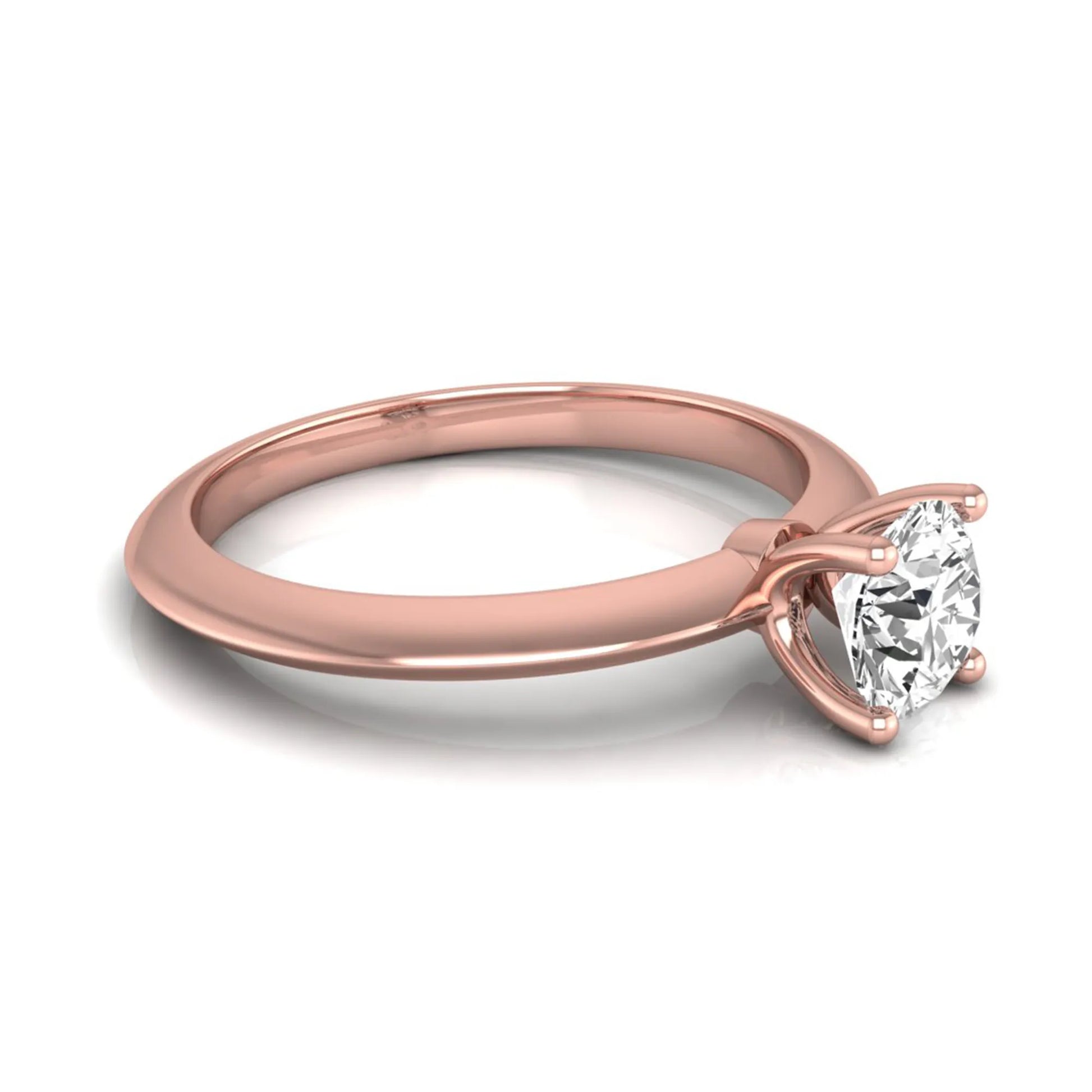 Round four prong lab grown diamond solitaire engagement ring featuring a 0.55 carat round cut center diamond in a classic rose gold design.