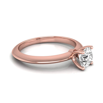 Round four prong lab grown diamond solitaire engagement ring featuring a 0.55 carat round cut center diamond in a classic rose gold design.
