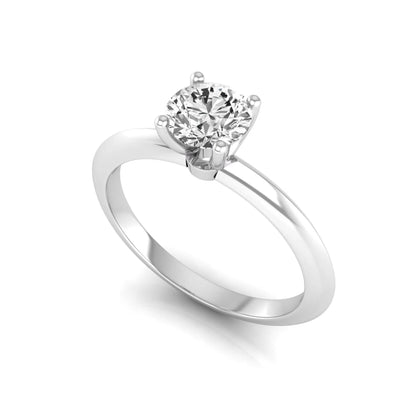 Round four prong lab grown diamond solitaire engagement ring featuring a 0.55 carat round cut center diamond in a classic white gold design.