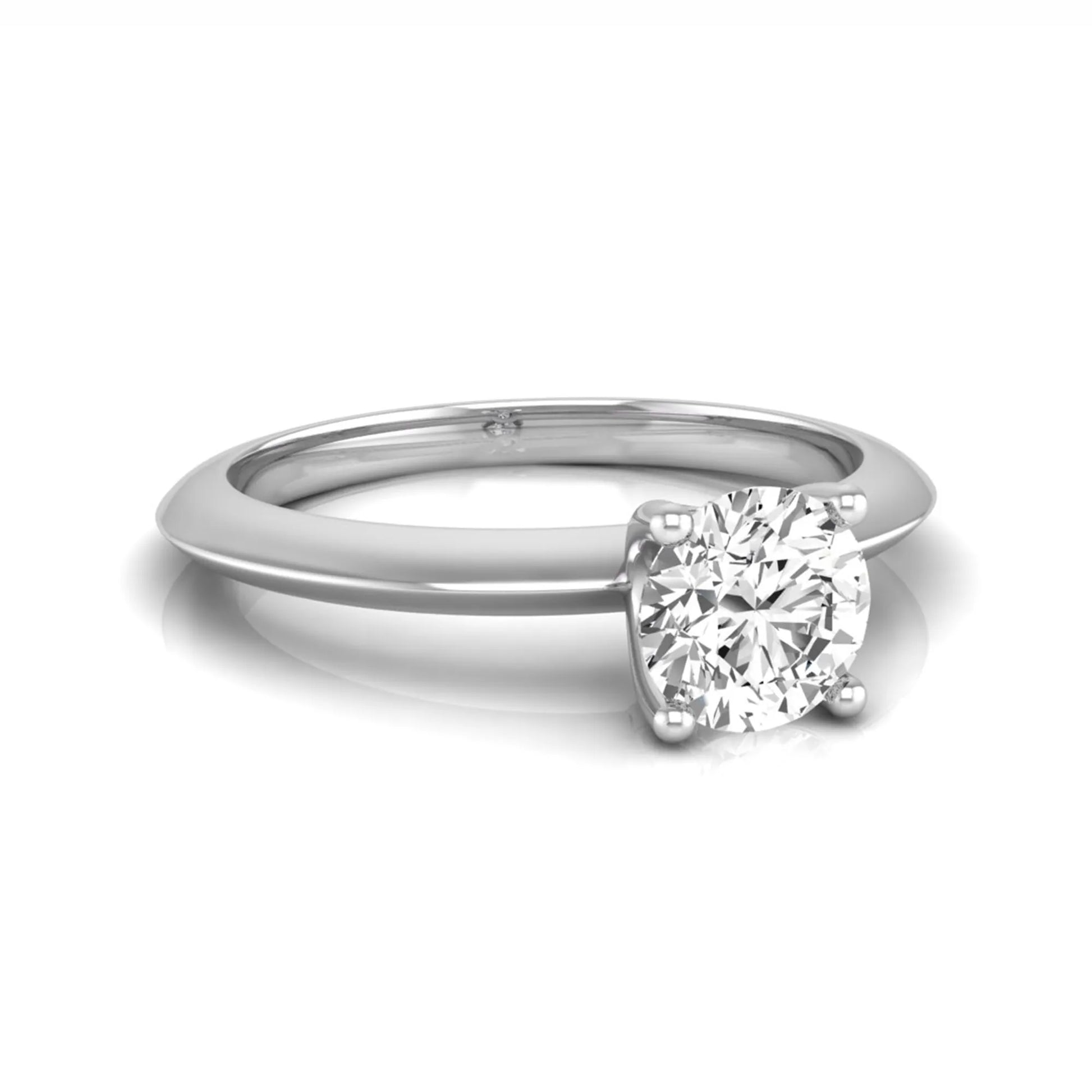 Round four prong lab grown diamond solitaire engagement ring featuring a 0.55 carat round cut center diamond in a classic white gold design.