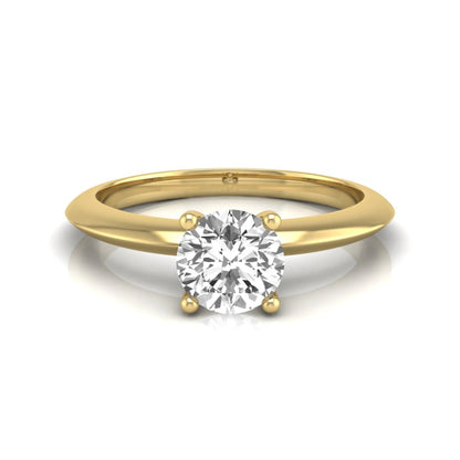 Round four prong lab grown diamond solitaire engagement ring featuring a 0.55 carat round cut center diamond in a classic yellow gold design.
