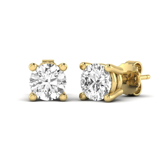 Round cut lab grown diamond stud earrings featuring a classic four-prong setting with yellow gold tone design and secure push back closure.
