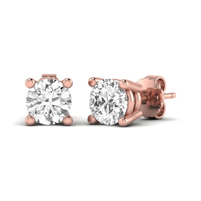 Round cut lab grown diamond stud earrings featuring a classic four-prong setting with rose gold tone design and secure push back closure.