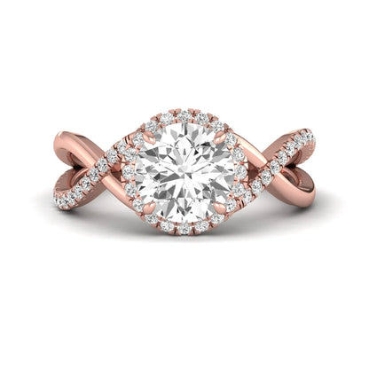 Round cut lab grown diamond halo engagement ring featuring a bypass split shank with pavé round diamonds in a rose gold tone design.