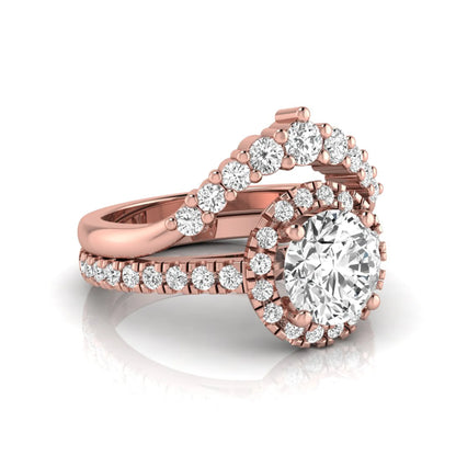 Round cut lab grown diamond halo bridal ring set featuring a pavé engagement ring with matching curved diamond wedding band in rose gold finish.
