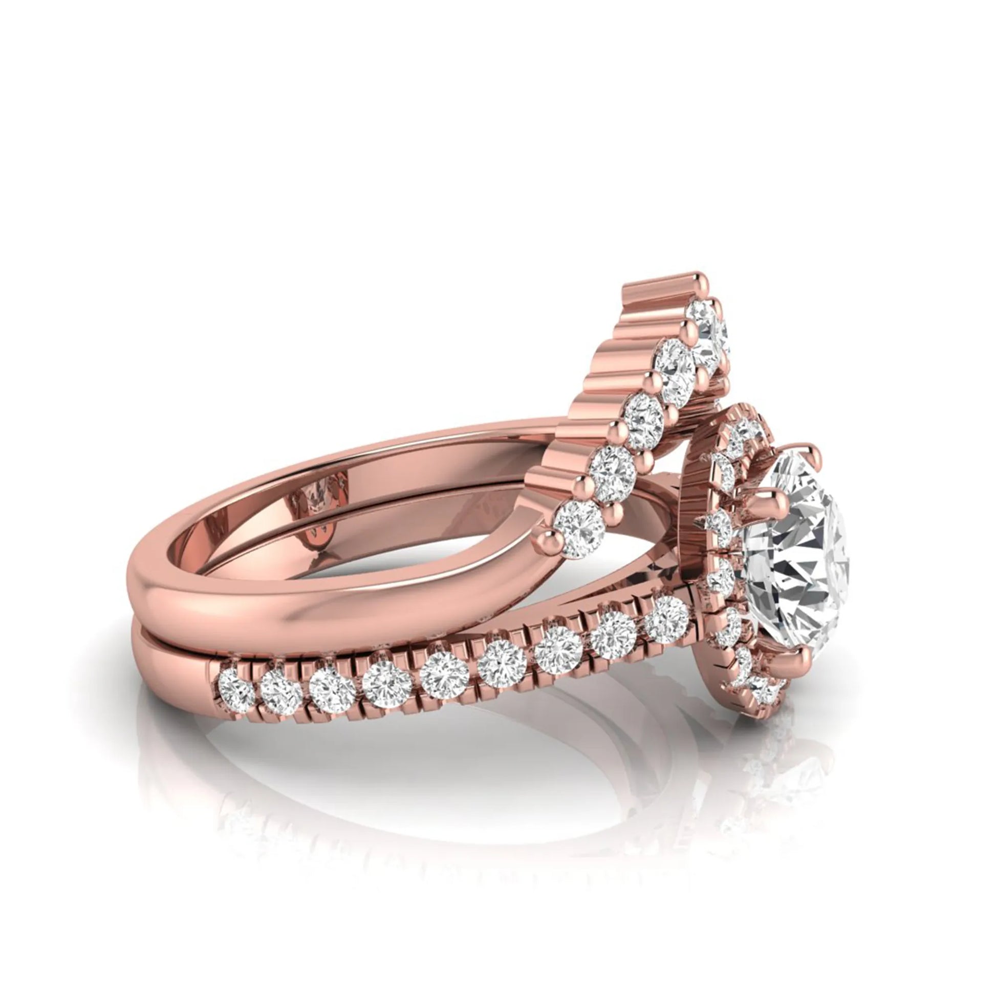 Round cut lab grown diamond halo bridal ring set featuring a pavé engagement ring with matching curved diamond wedding band in rose gold finish.