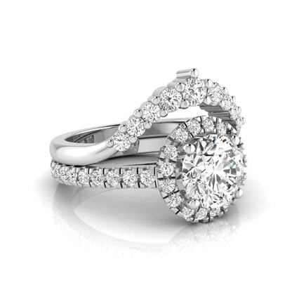 Round cut lab grown diamond halo bridal ring set featuring a pavé engagement ring with matching curved diamond wedding band in white gold finish.