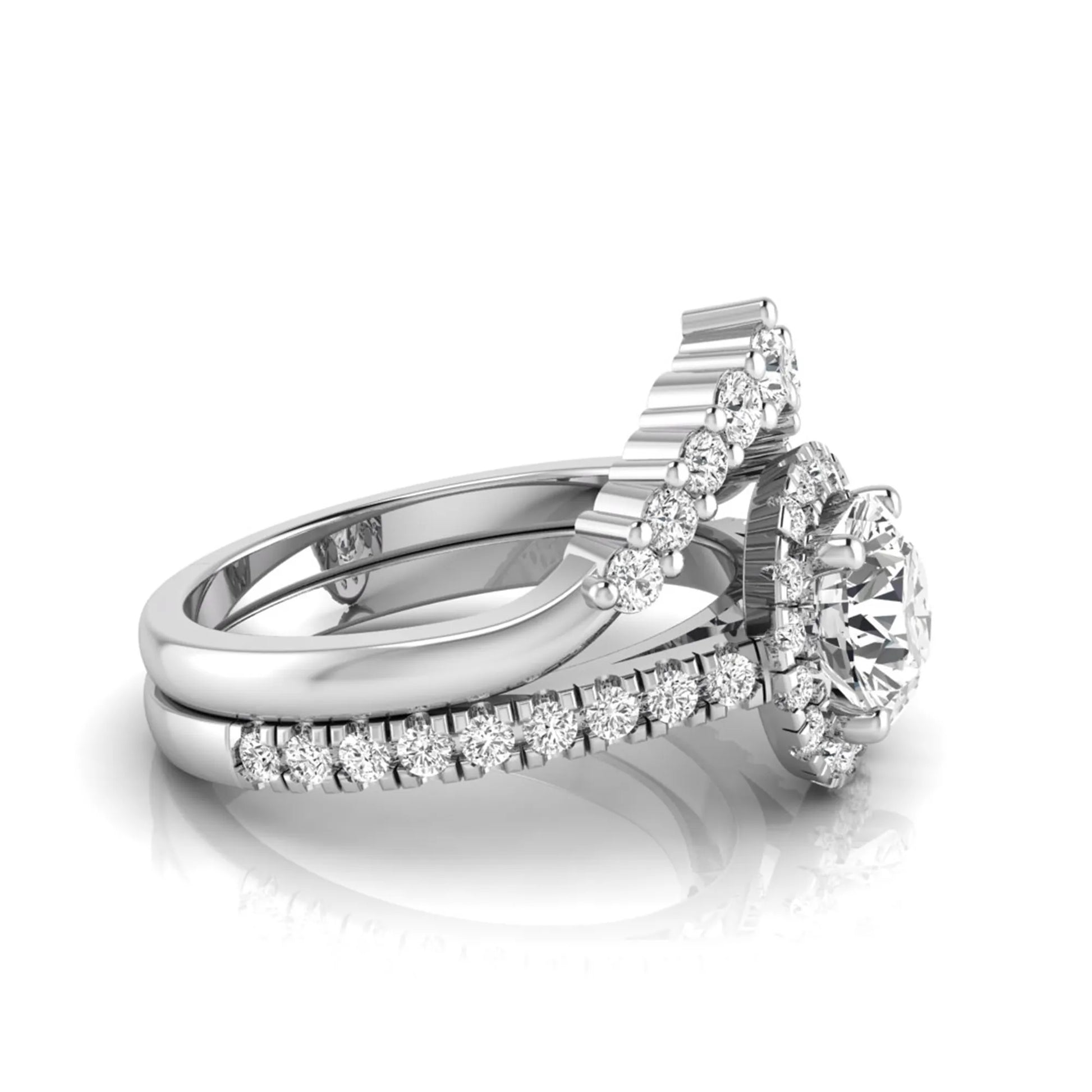 Round cut lab grown diamond halo bridal ring set featuring a pavé engagement ring with matching curved diamond wedding band in white gold finish.