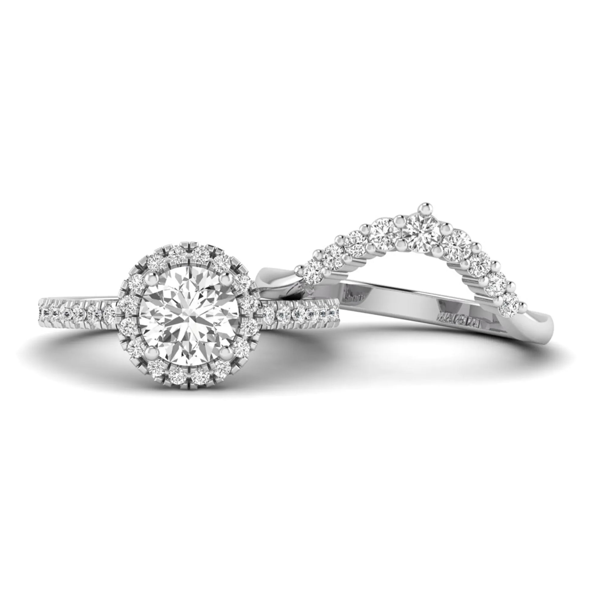 Round cut lab grown diamond halo bridal ring set featuring a pavé engagement ring with matching curved diamond wedding band in white gold finish.