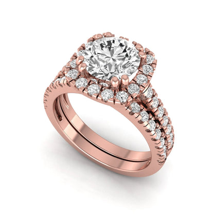 Round cut lab grown diamond halo bridal ring set featuring a split pavé engagement ring with matching diamond wedding band in rose gold finish.
