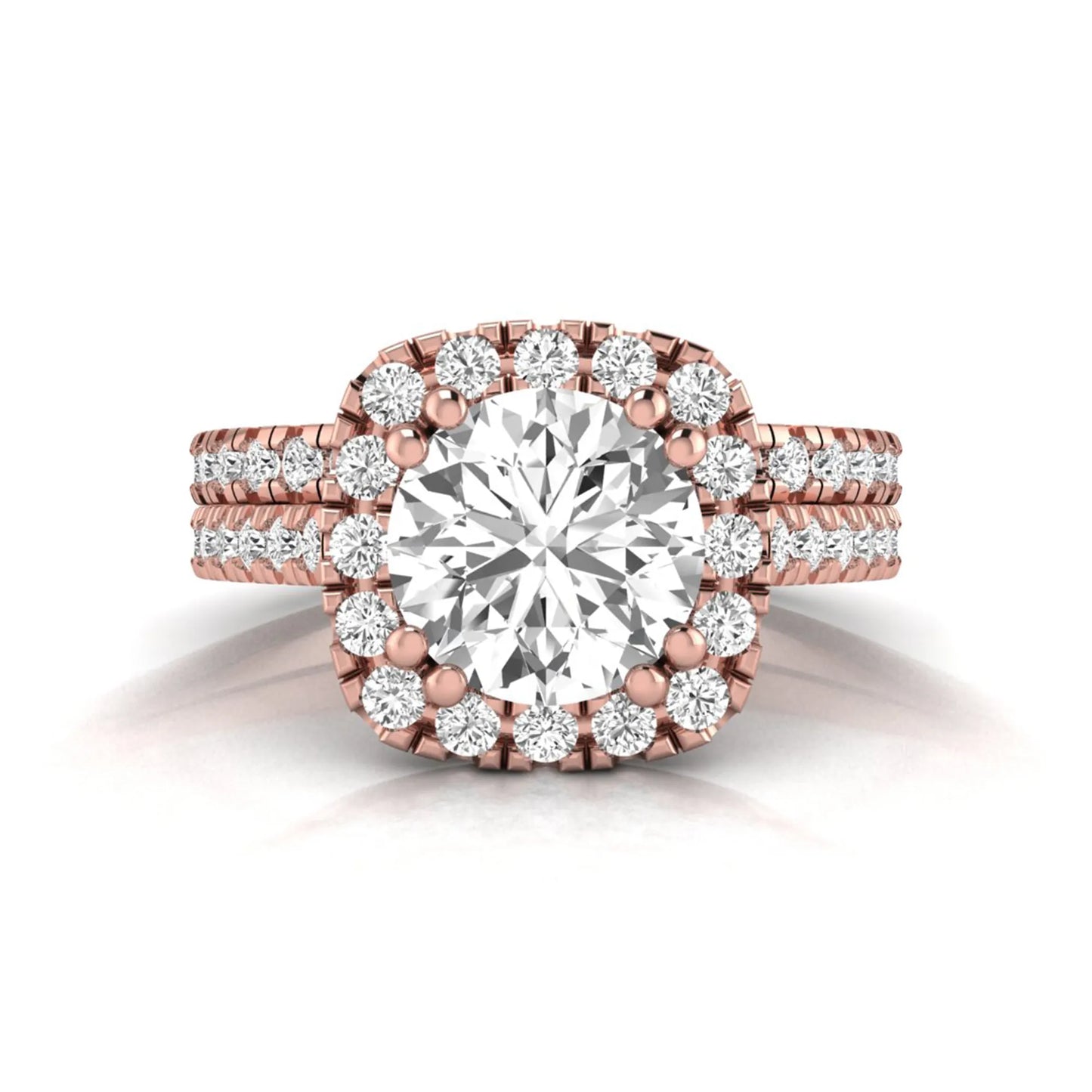 Round cut lab grown diamond halo bridal ring set featuring a split pavé engagement ring with matching diamond wedding band in rose gold finish.