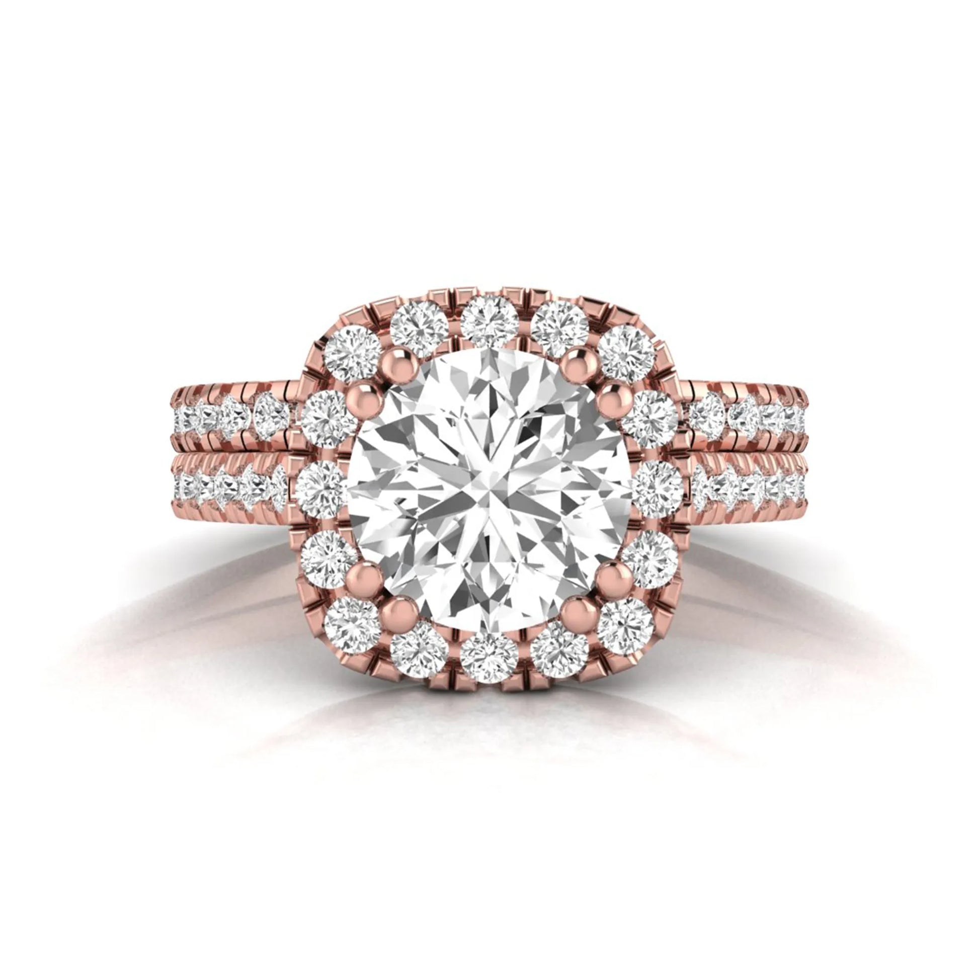 Round cut lab grown diamond halo bridal ring set featuring a split pavé engagement ring with matching diamond wedding band in rose gold finish.
