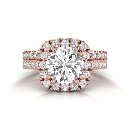 Round cut lab grown diamond halo bridal ring set featuring a split pavé engagement ring with matching diamond wedding band in rose gold finish.