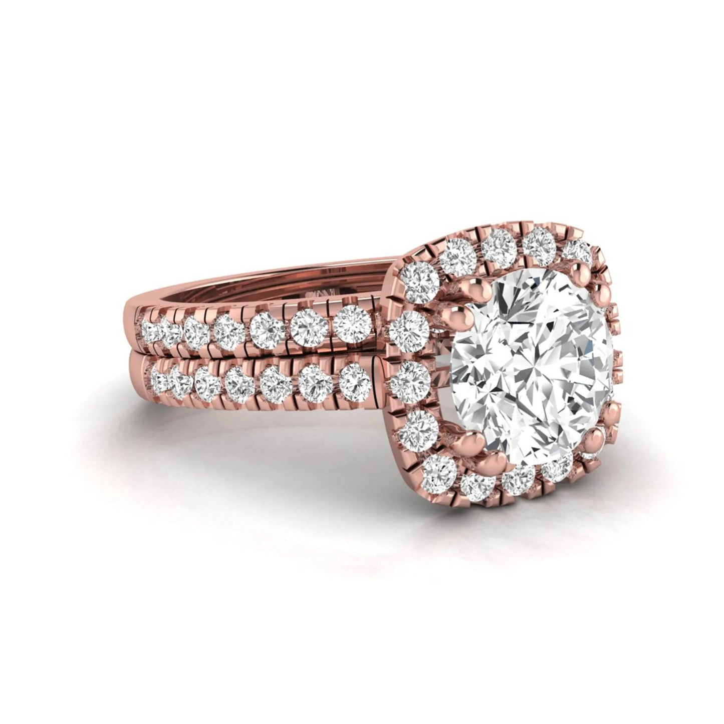 Round cut lab grown diamond halo bridal ring set featuring a split pavé engagement ring with matching diamond wedding band in rose gold finish.
