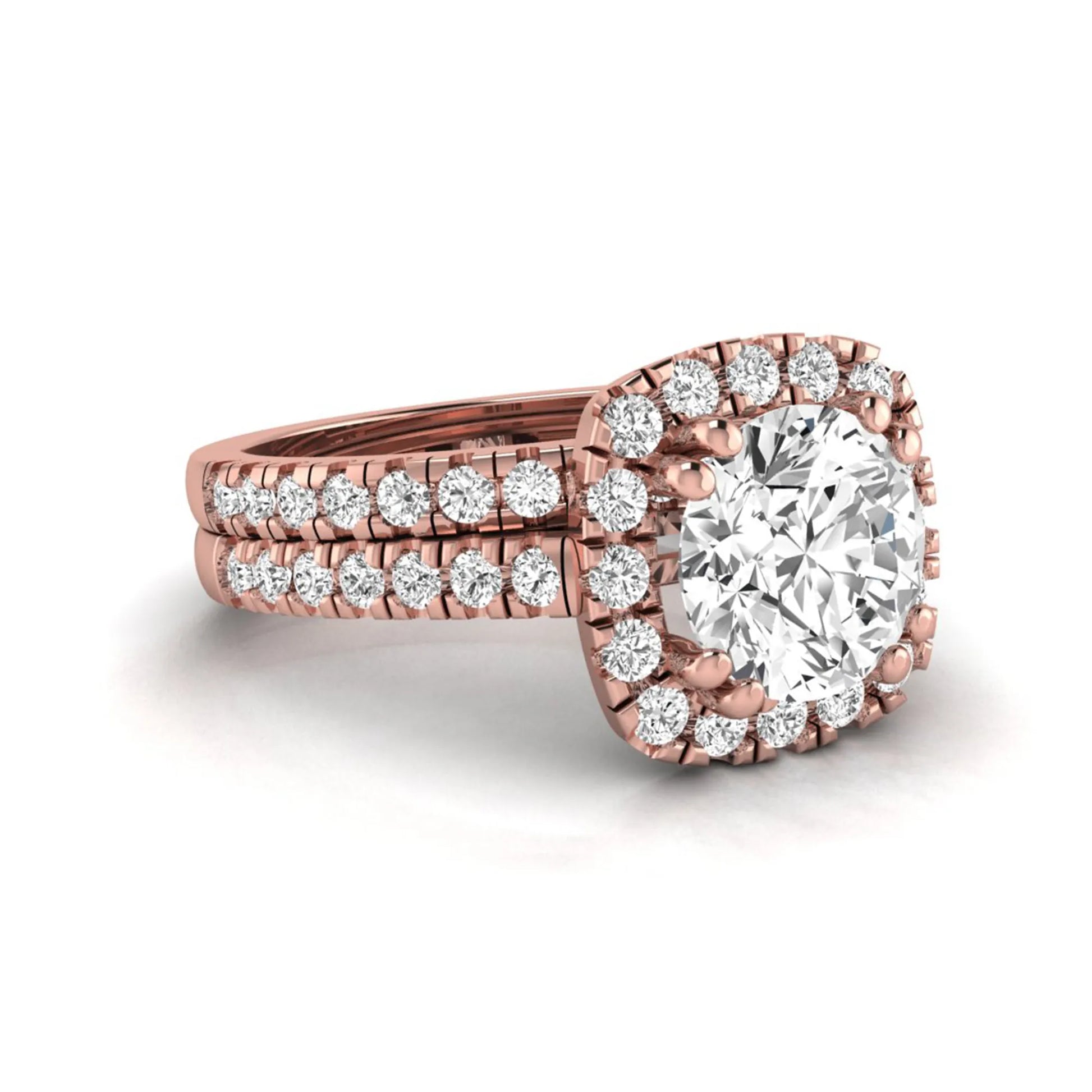 Round cut lab grown diamond halo bridal ring set featuring a split pavé engagement ring with matching diamond wedding band in rose gold finish.