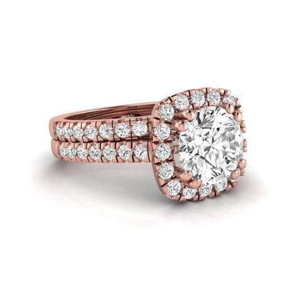 Round cut lab grown diamond halo bridal ring set featuring a split pavé engagement ring with matching diamond wedding band in rose gold finish.