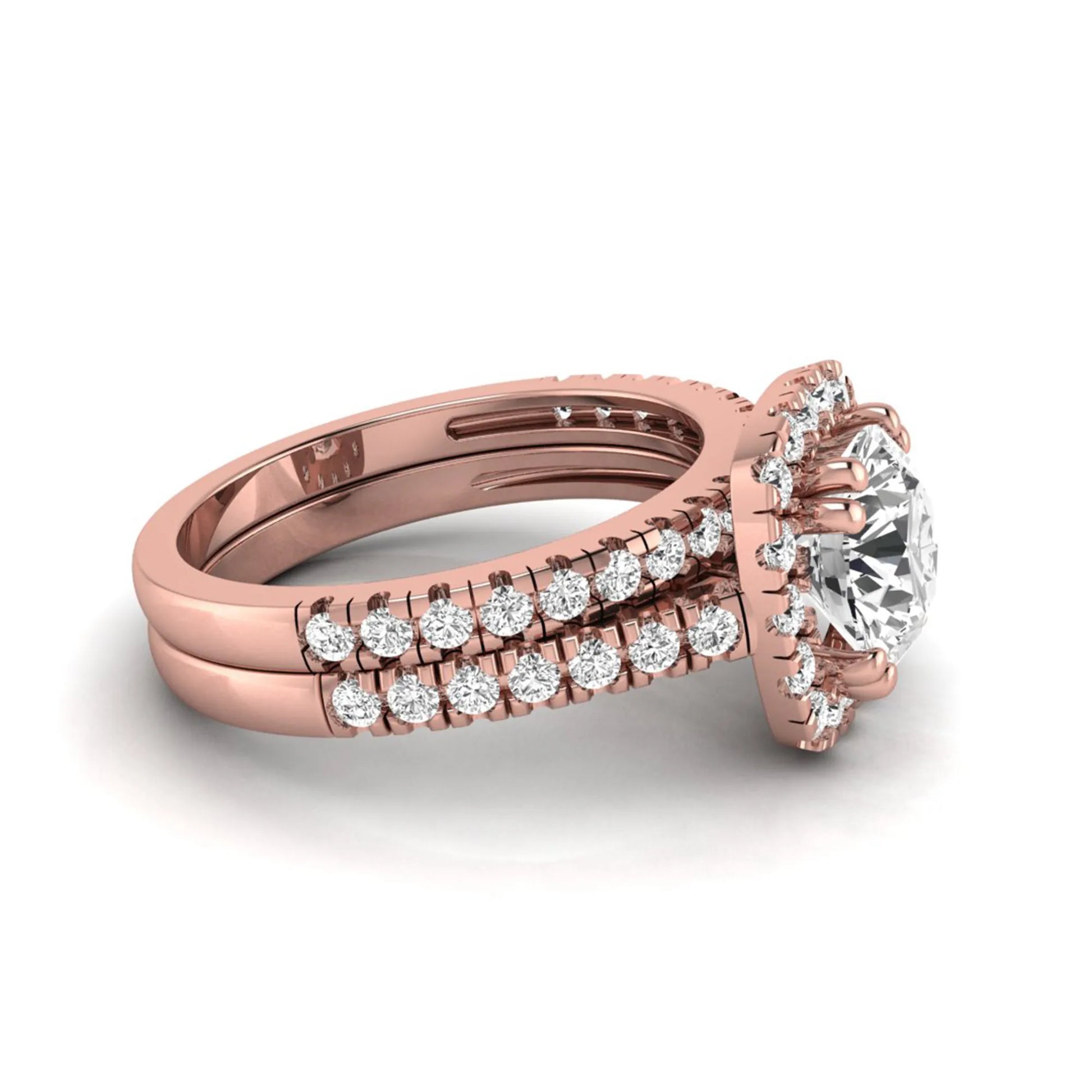 Round cut lab grown diamond halo bridal ring set featuring a split pavé engagement ring with matching diamond wedding band in rose gold finish.