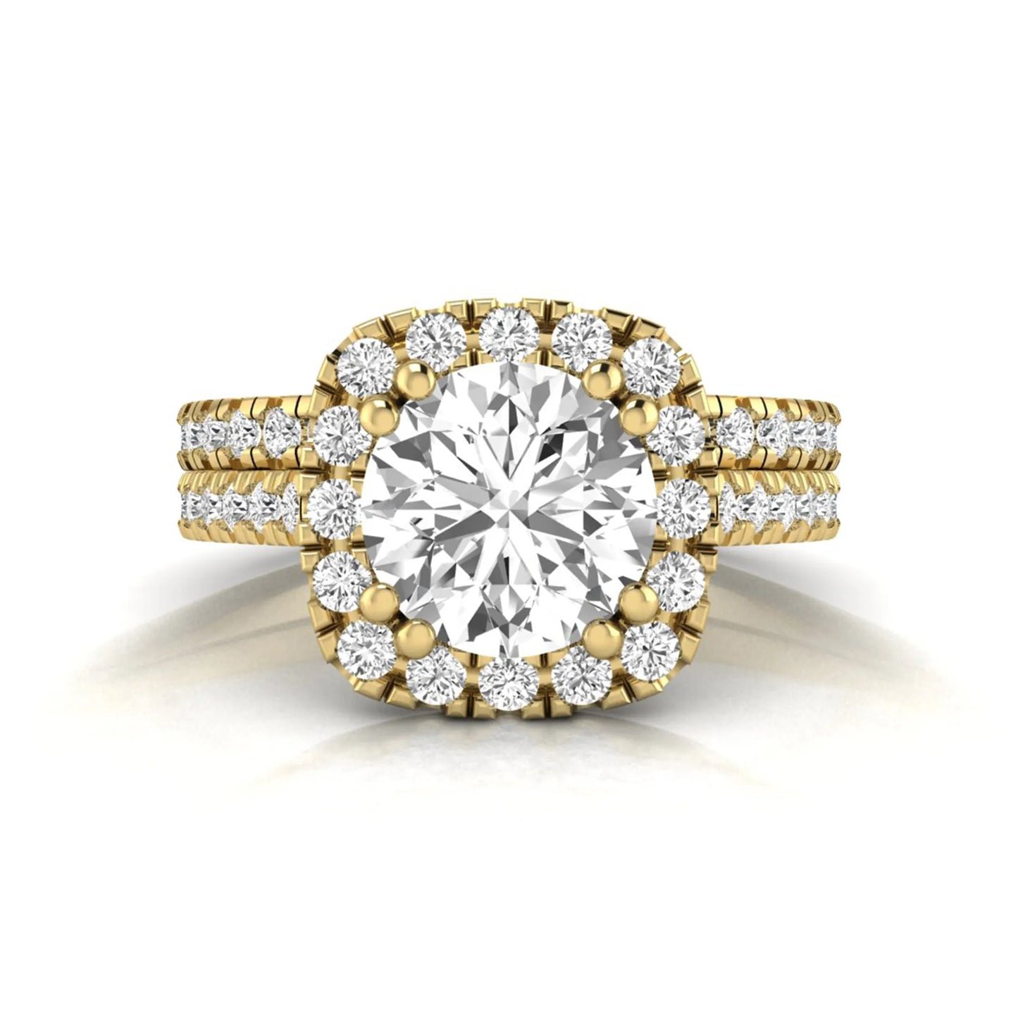 Round cut lab grown diamond halo bridal ring set featuring a split pavé engagement ring with matching diamond wedding band in yellow gold finish.