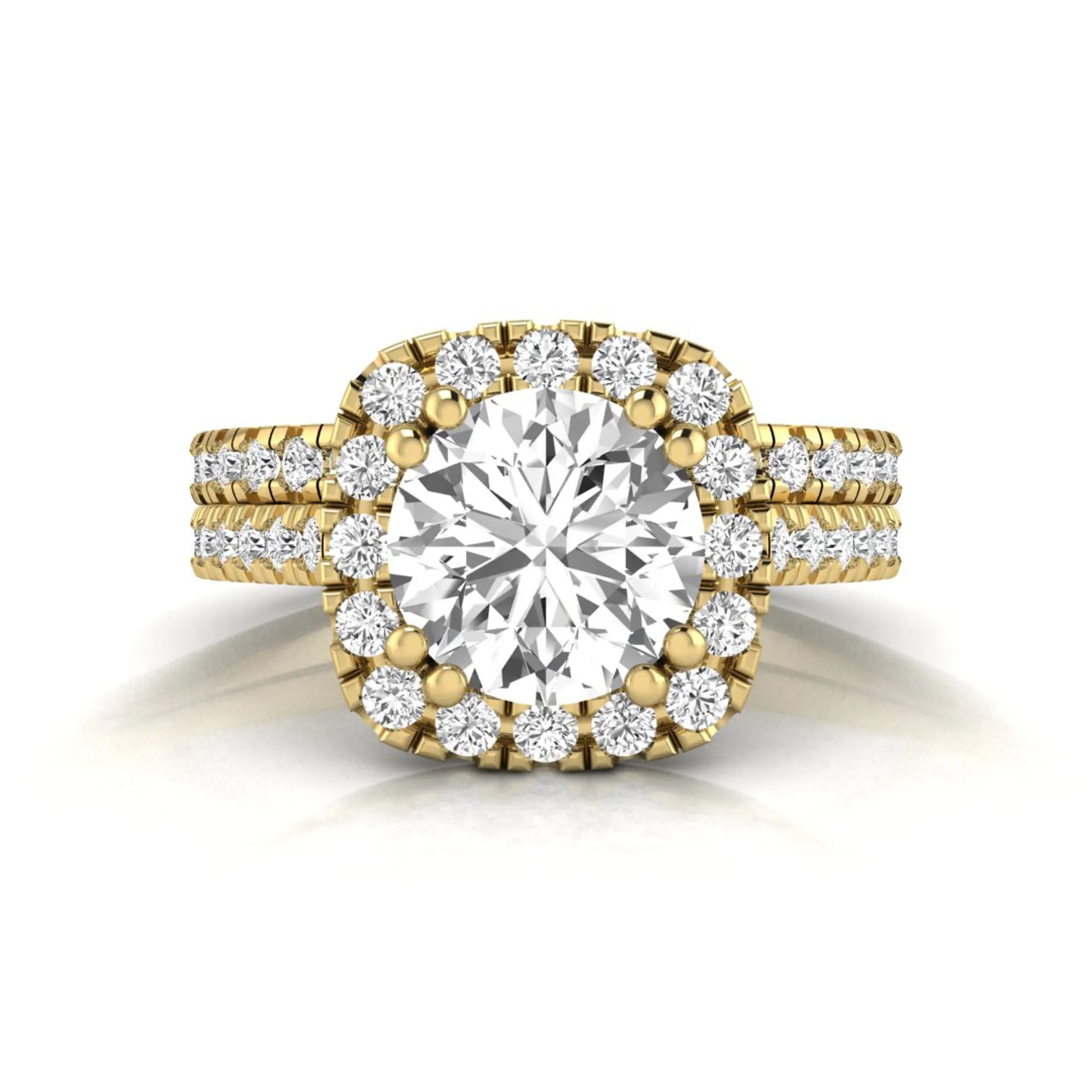 Round cut lab grown diamond halo bridal ring set featuring a split pavé engagement ring with matching diamond wedding band in yellow gold finish.