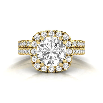 Round cut lab grown diamond halo bridal ring set featuring a split pavé engagement ring with matching diamond wedding band in yellow gold finish.