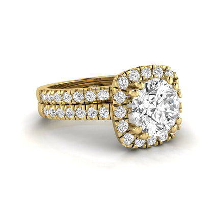 Round cut lab grown diamond halo bridal ring set featuring a split pavé engagement ring with matching diamond wedding band in yellow gold finish.
