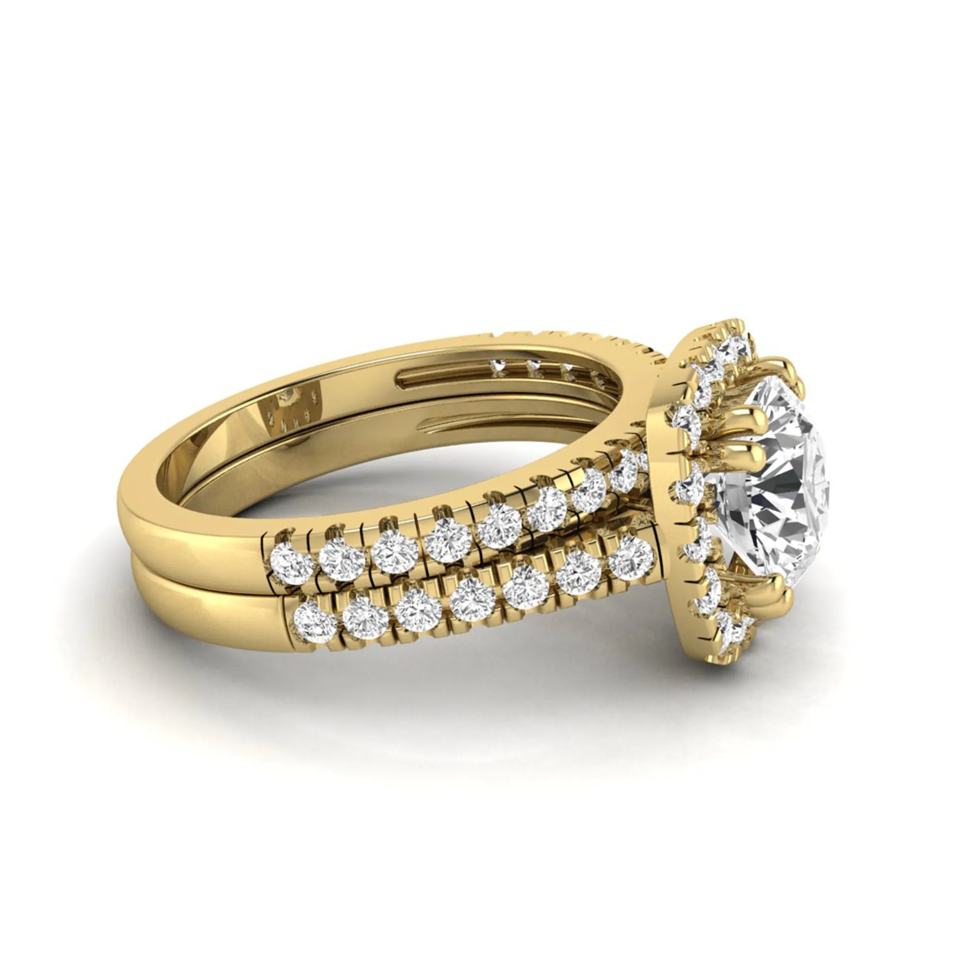 Round cut lab grown diamond halo bridal ring set featuring a split pavé engagement ring with matching diamond wedding band in yellow gold finish.