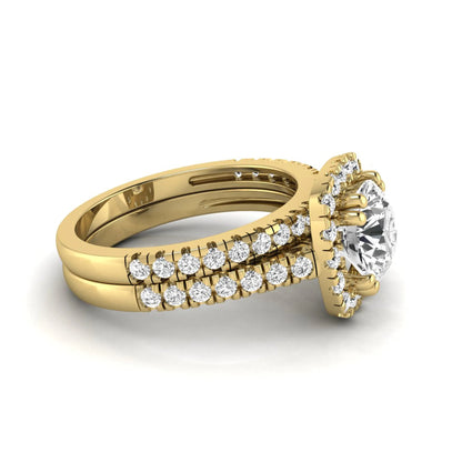 Round cut lab grown diamond halo bridal ring set featuring a split pavé engagement ring with matching diamond wedding band in yellow gold finish.