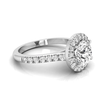 Round cut lab grown diamond engagement ring featuring a 1.33 carat center diamond surrounded by a round halo with a pavé diamond band and polished white gold finish.