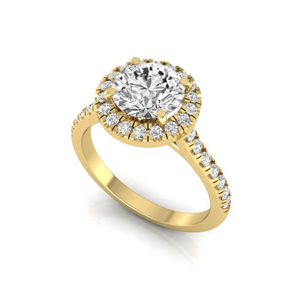 Round cut lab grown diamond engagement ring featuring a 1.33 carat center diamond surrounded by a round halo with a pavé diamond band and polished yellow gold finish.