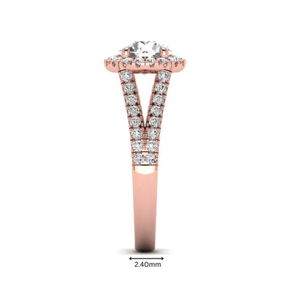 Round cut lab grown diamond halo engagement ring with pavé split shank and round accent diamonds in a rose gold tone design.