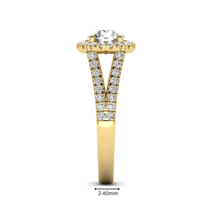 Round cut lab grown diamond halo engagement ring with pavé split shank and round accent diamonds in a yellow gold tone design.