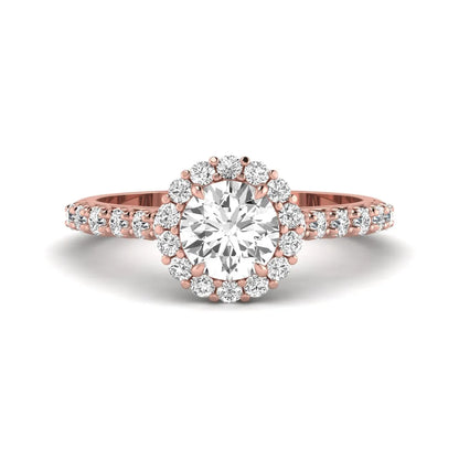 Round halo lab grown diamond engagement ring featuring a 6.50 mm round center diamond with pavé band and prong-set halo in a rose gold tone design.