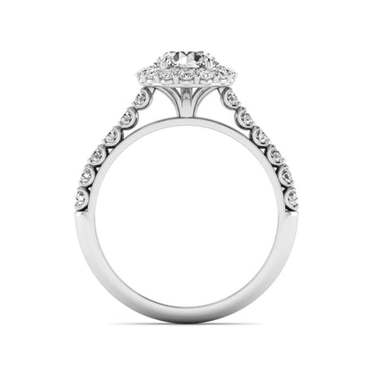 Round halo lab grown diamond engagement ring featuring a 6.50 mm round center diamond with pavé band and prong-set halo in a white gold tone design.