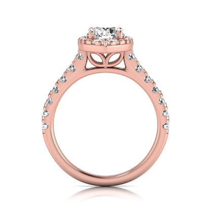 Round cut lab grown diamond engagement ring with a sparkling halo, pavé side stones, and four-prong setting in rose gold style.