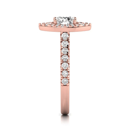 Round cut lab grown diamond engagement ring with a sparkling halo, pavé side stones, and four-prong setting in rose gold style.