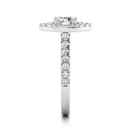 Round cut lab grown diamond engagement ring with a sparkling halo, pavé side stones, and four-prong setting in white gold style.
