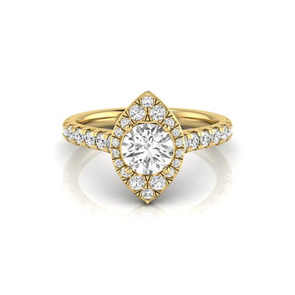 Round cut lab grown diamond engagement ring with a sparkling halo, pavé side stones, and four-prong setting in yellow gold style.