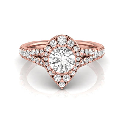 Round halo split shank lab grown diamond engagement ring featuring a round center diamond with pavé halo, cathedral gallery, and pavé-set split shank in rose gold tone.