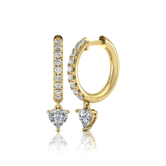 Round and heart cut lab grown diamond pavé drop huggie hoop earrings featuring a heart diamond drop, round pavé diamonds, hinged snap closure, and polished yellow gold finish.