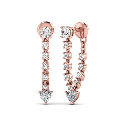 Round and heart cut prong set lab grown diamond drop earrings featuring a graceful linear design in a rose gold finish with push back closure.