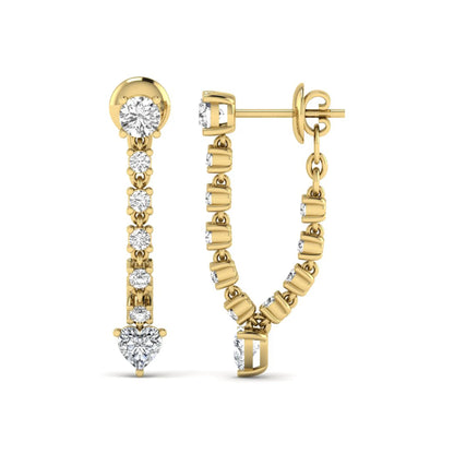 Round and heart cut prong set lab grown diamond drop earrings featuring a graceful linear design in a yellow gold finish with push back closure.