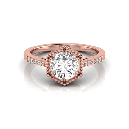 Round cut lab grown diamond engagement ring featuring a hexagon-inspired halo with pavé accent diamonds in a prong setting and polished rose gold tone band.