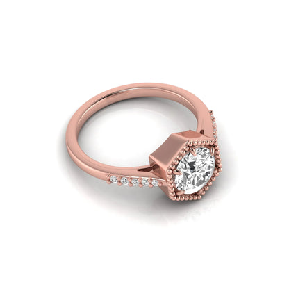 Round cut lab grown diamond engagement ring featuring a hexagon-inspired halo with pavé accent diamonds in a prong setting and polished rose gold tone band.