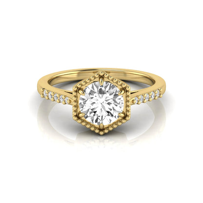 Round cut lab grown diamond engagement ring featuring a hexagon-inspired halo with pavé accent diamonds in a prong setting and polished yellow gold tone band.