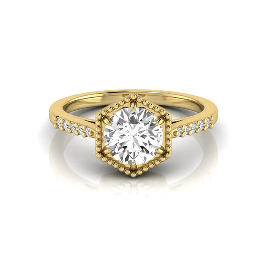 Round cut lab grown diamond engagement ring featuring a hexagon-inspired halo with pavé accent diamonds in a prong setting and polished yellow gold tone band.